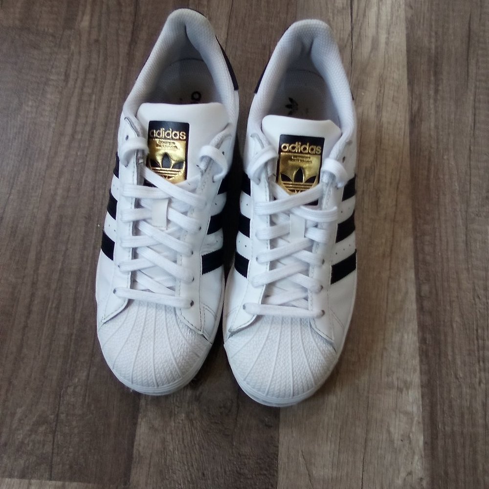 Adidas low top black and white superstar sneakers
